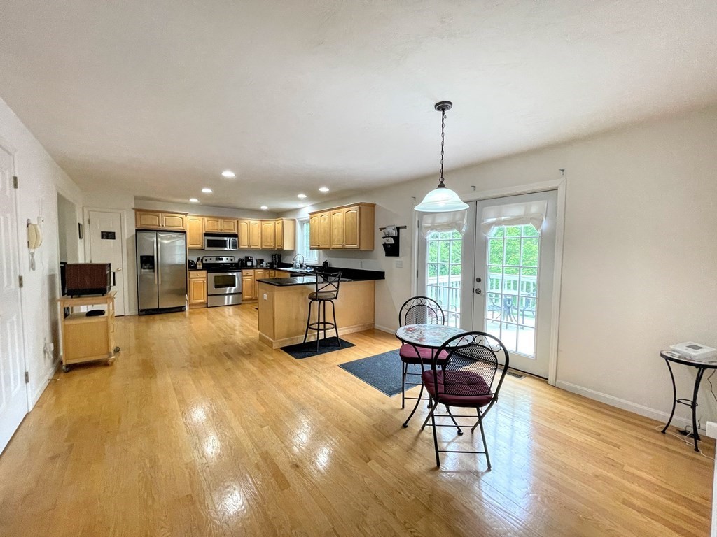 149 Groton Road Shirley, MA 01464 - Photo 5 of 32 a living room with furniture and kitchen view