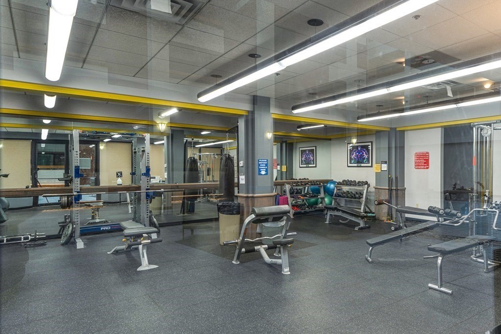357 Commercial Street, Unit 617 Boston, MA 02109 - Photo 11 of 15 a room with gym equipment and lots of glass windows