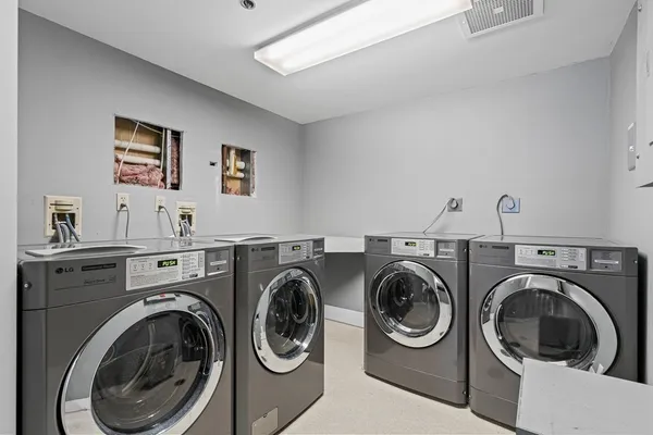 a view of a roof deck with wooden floor and barbeque oven
