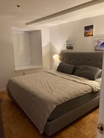 a bedroom with a bed and window