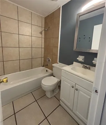 a bathroom with a sink a toilet and bathtub
