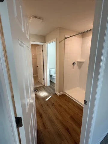 a view of entryway with wooden floor