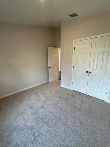 a view of an empty room and entryway