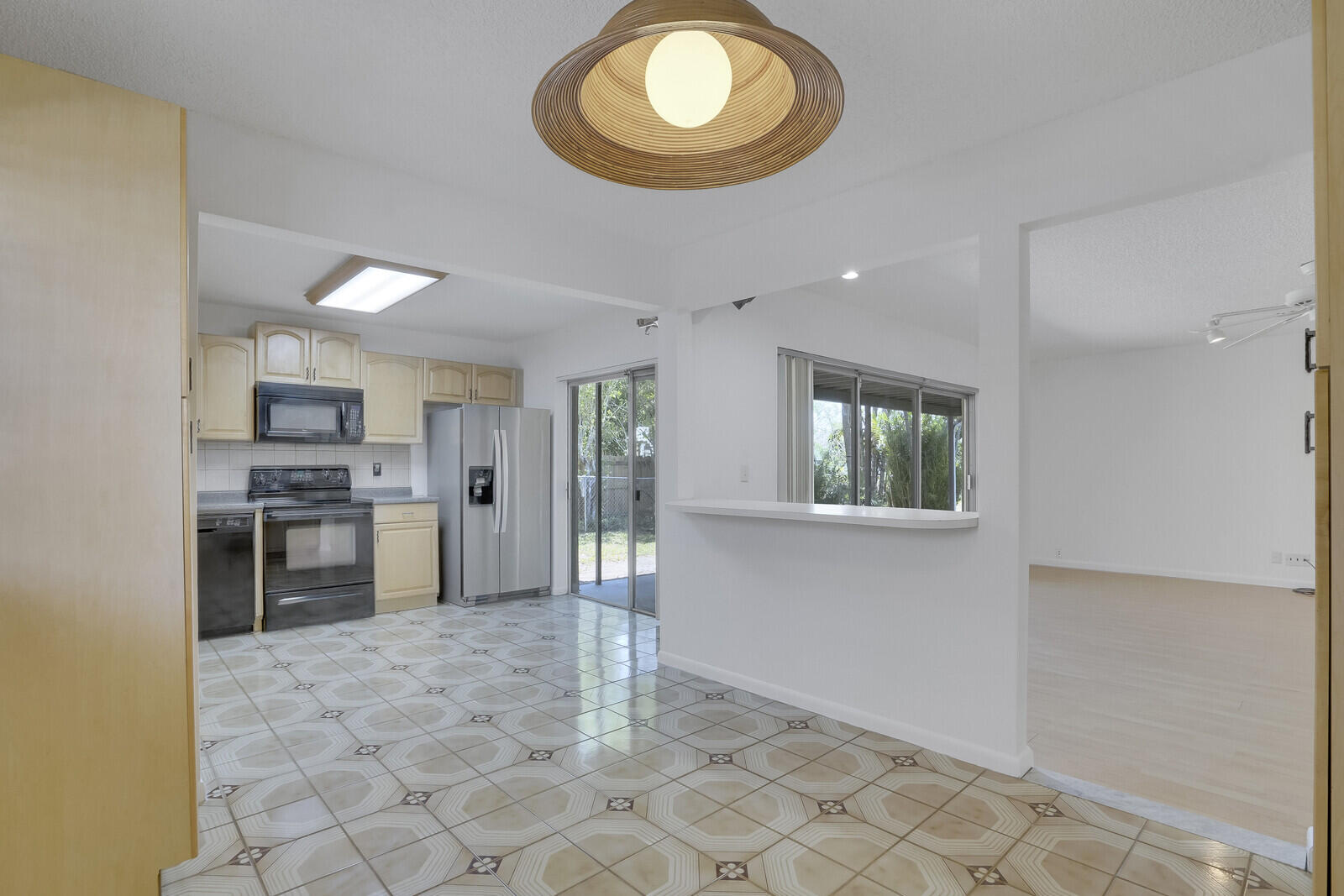 9260 Southwest 16th Road West Boca Raton, FL 33428 - Photo 11 of 46 a view of kitchen with stove microwave and cabinets
