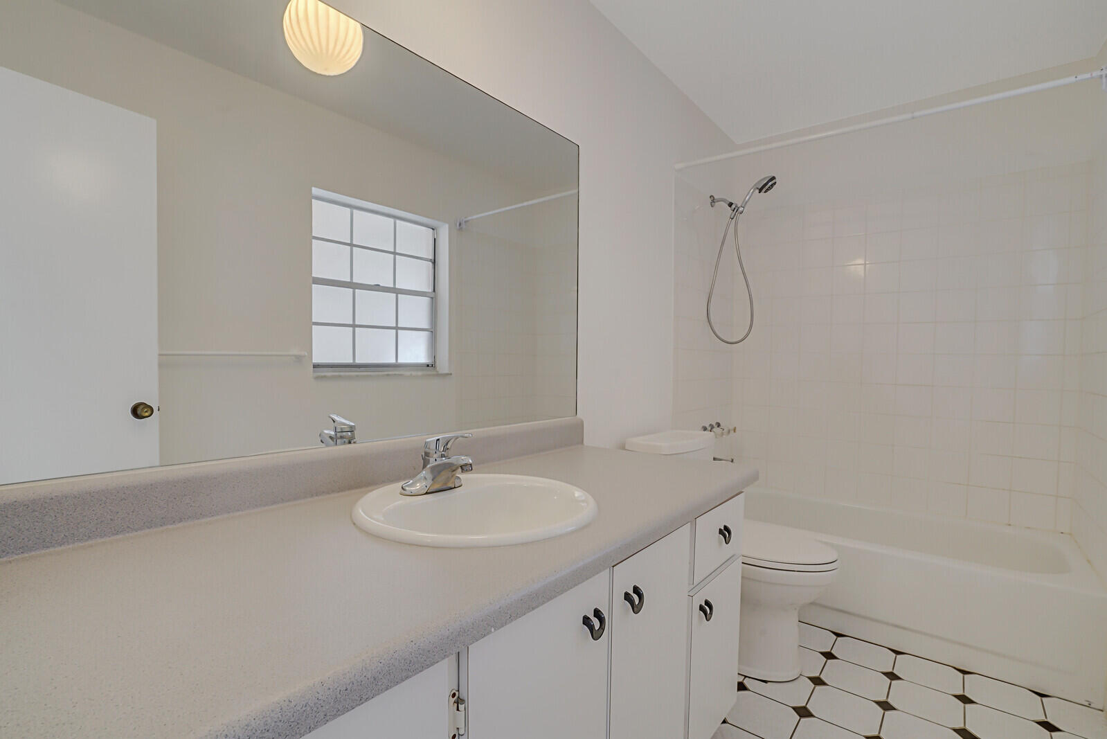 9260 Southwest 16th Road West Boca Raton, FL 33428 - Photo 19 of 46 a bathroom with a sink a toilet and shower