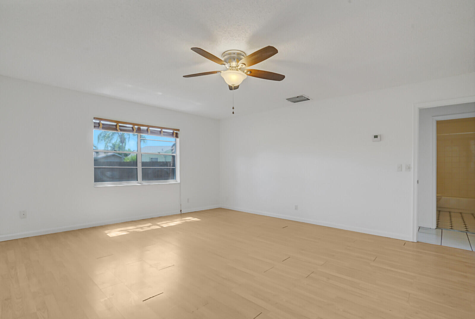 9260 Southwest 16th Road West Boca Raton, FL 33428 - Photo 21 of 46 a view of an empty room with a window