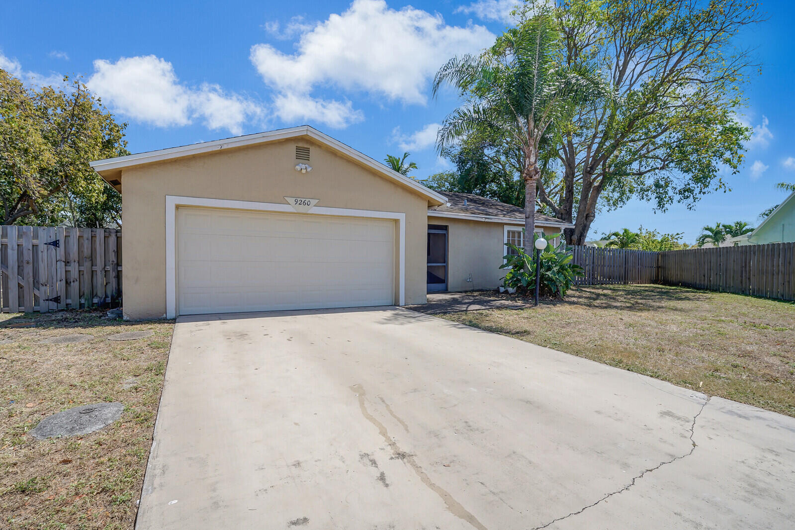 9260 Southwest 16th Road West Boca Raton, FL 33428 - Photo 3 of 46 a view of garage yard and tree