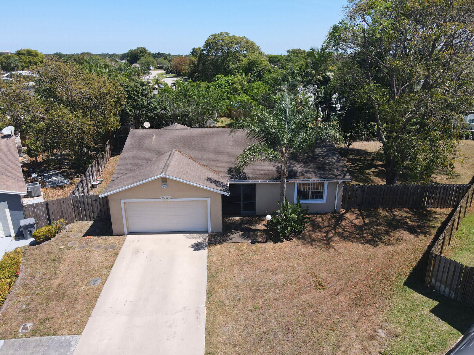 9260 Southwest 16th Road West Boca Raton, FL 33428 - Photo 35 of 46 front view of a house with a yard