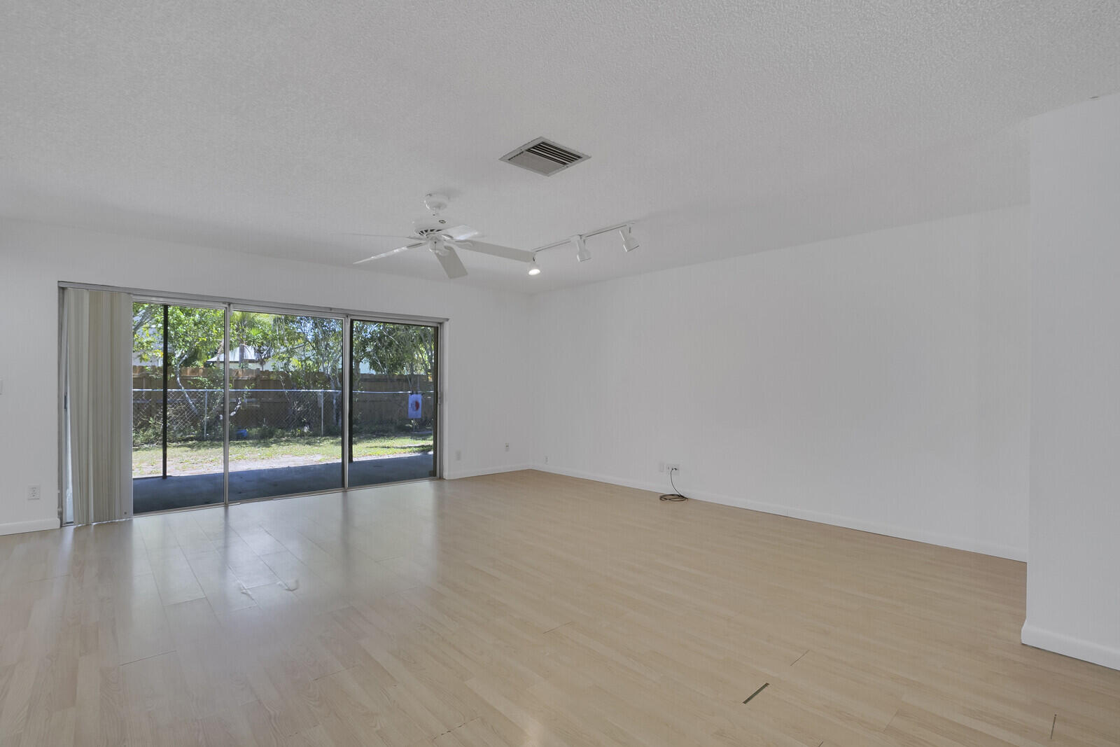 9260 Southwest 16th Road West Boca Raton, FL 33428 - Photo 7 of 46 an empty room with wooden floor and windows