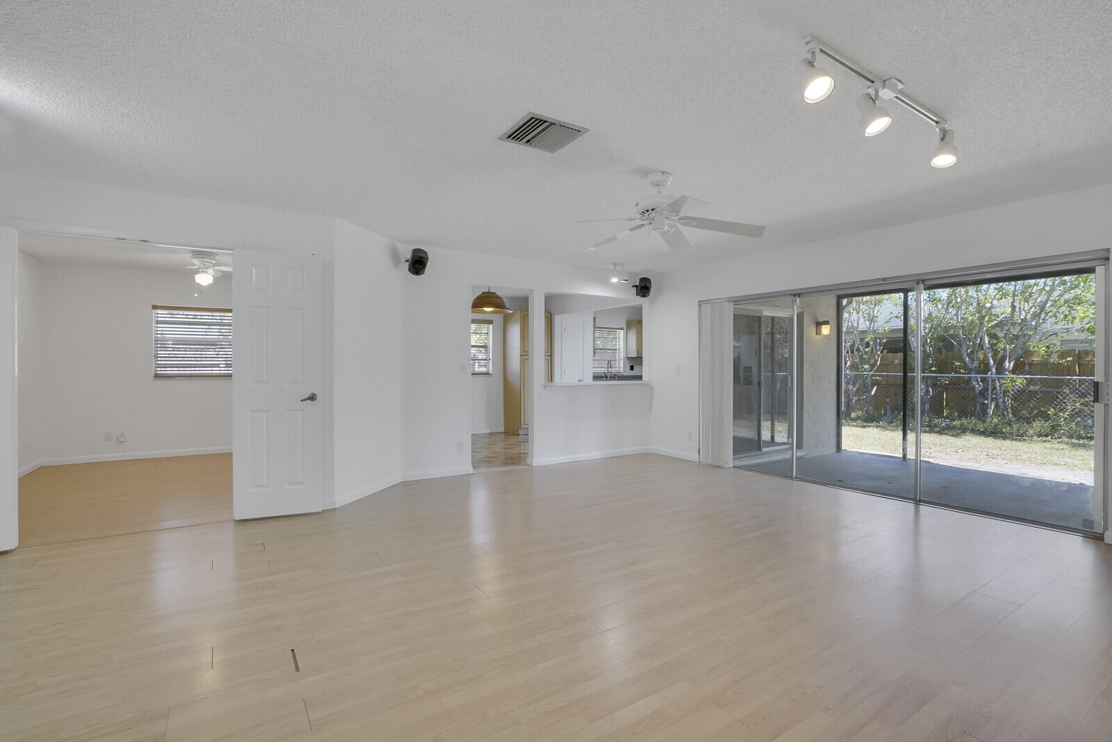 9260 Southwest 16th Road West Boca Raton, FL 33428 - Photo 8 of 46 a view of a livingroom with wooden floor and windows