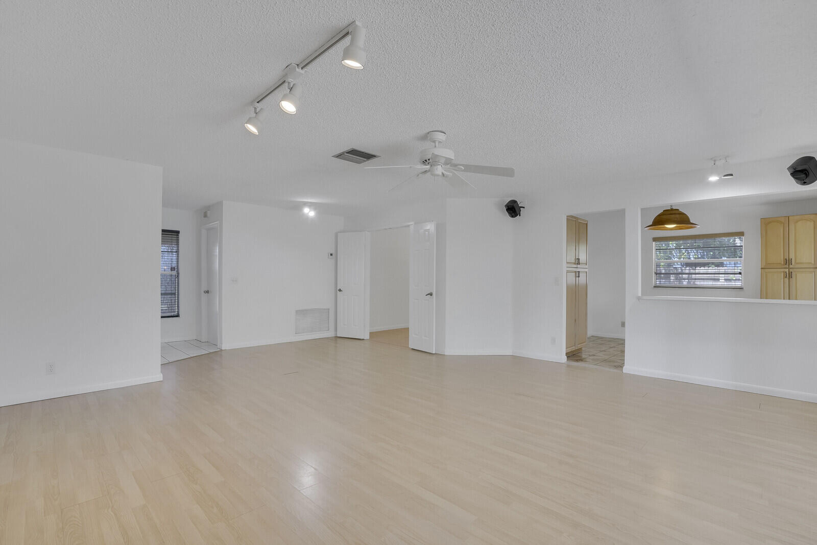 9260 Southwest 16th Road West Boca Raton, FL 33428 - Photo 9 of 46 an empty room with an entryway and windows