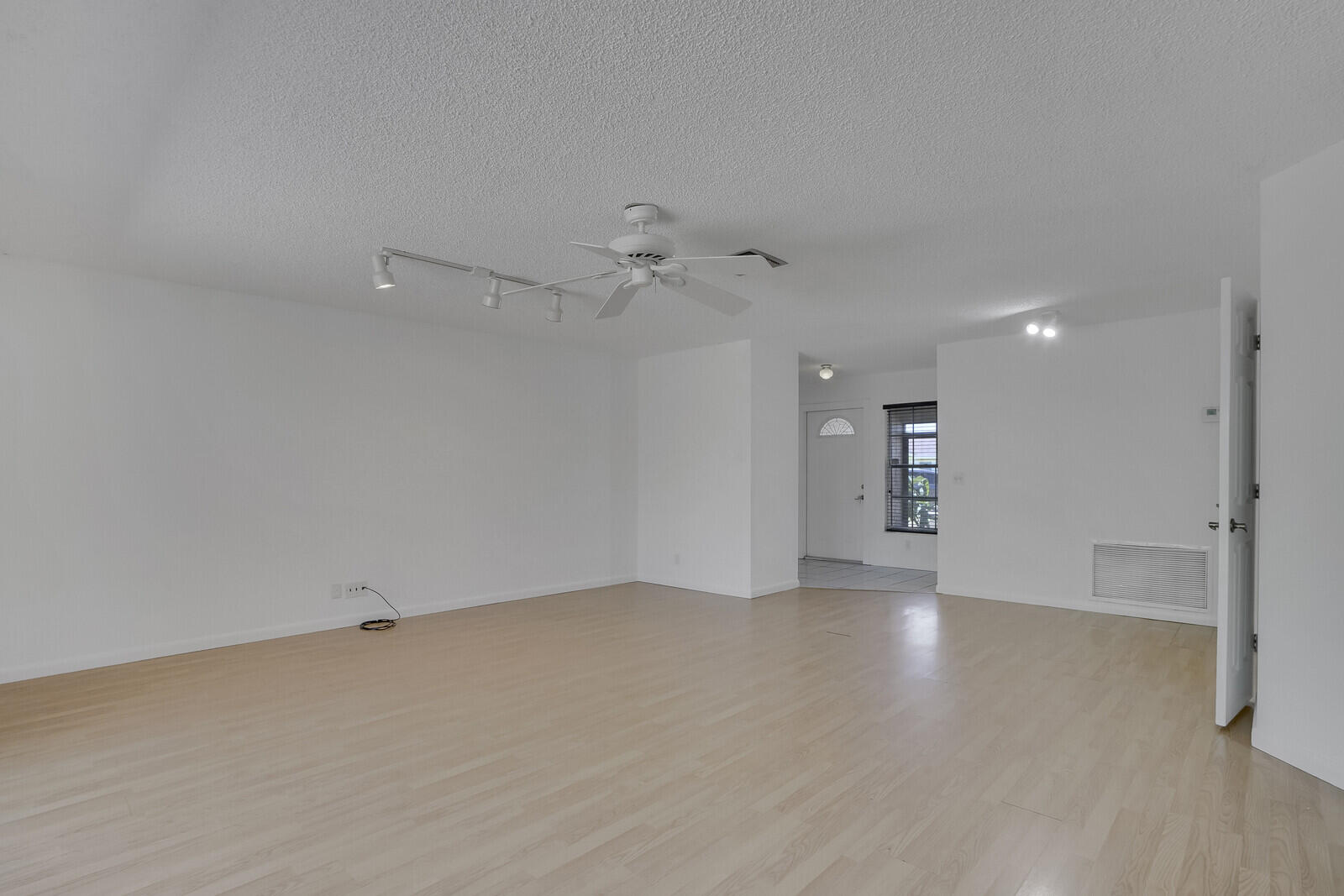 9260 Southwest 16th Road West Boca Raton, FL 33428 - Photo 10 of 46 an empty room with a empty space and a ceiling fan