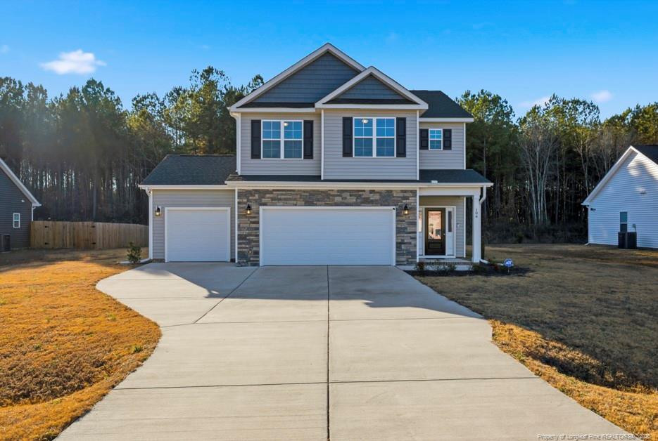 a front view of a house with yard