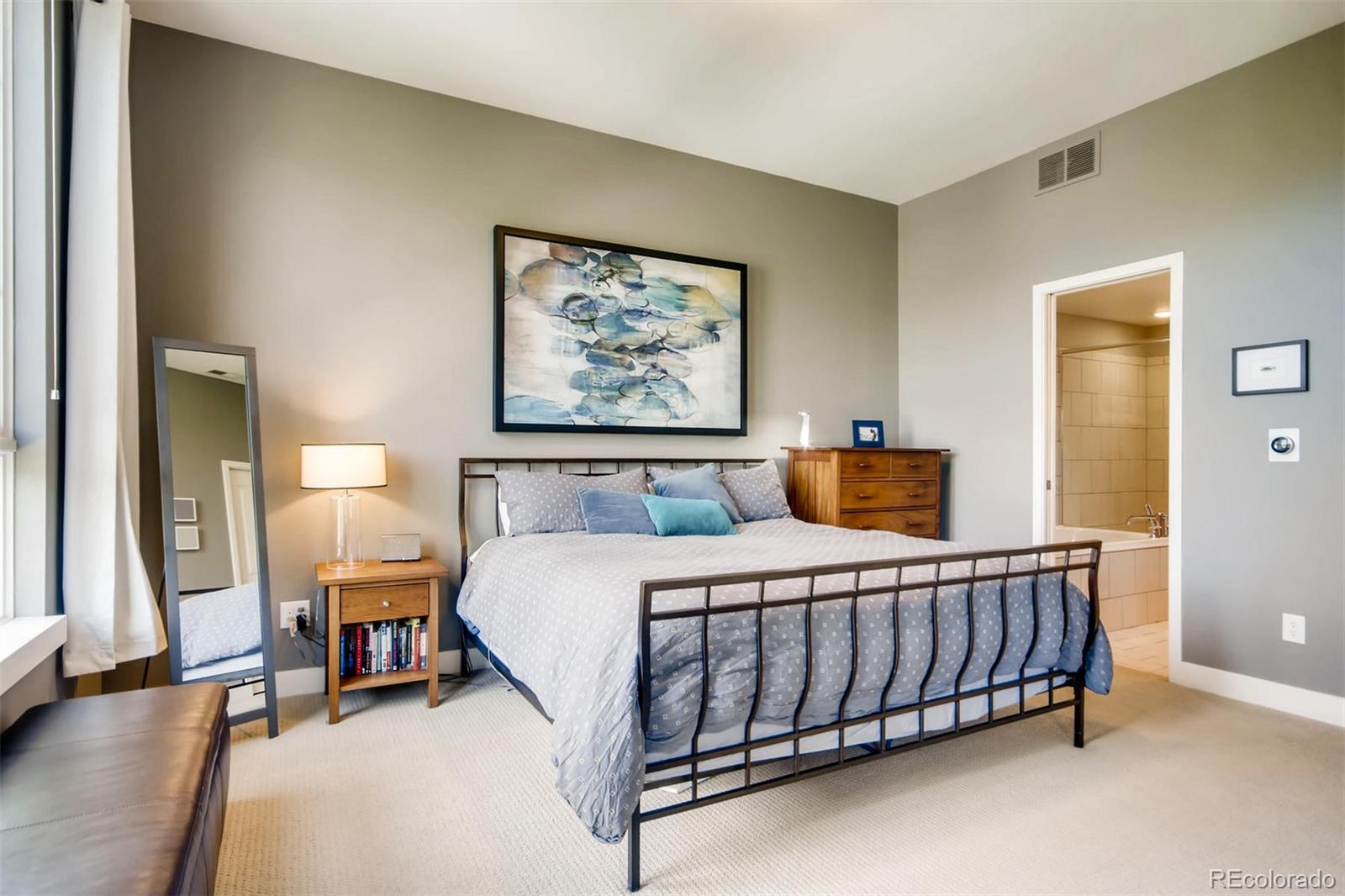 3231 Perry Street Denver, CO 80212 - Photo 15 of 36 a bedroom with a bed and a chandelier