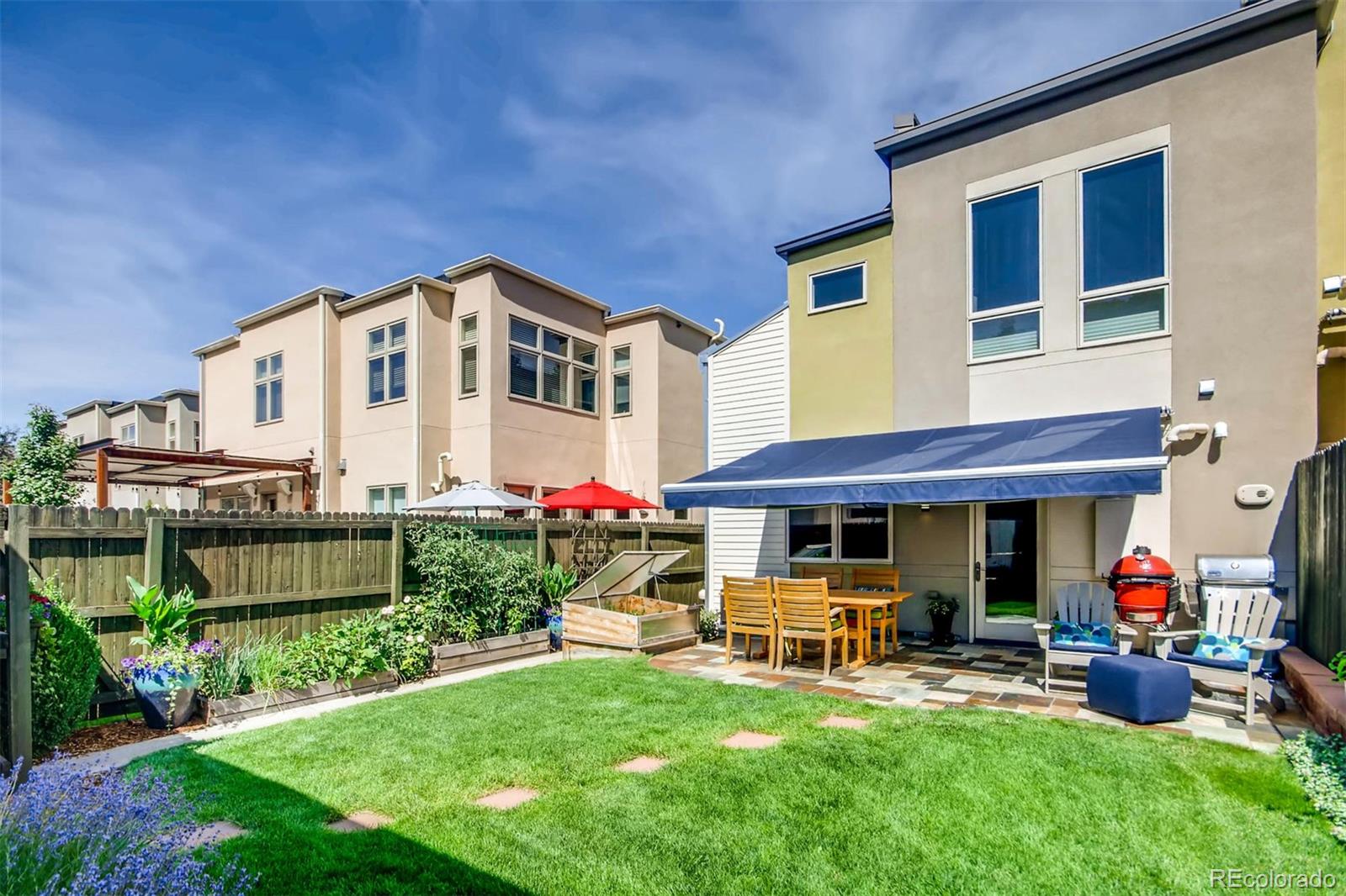 3231 Perry Street Denver, CO 80212 - Photo 28 of 36 a front view of a house with garden