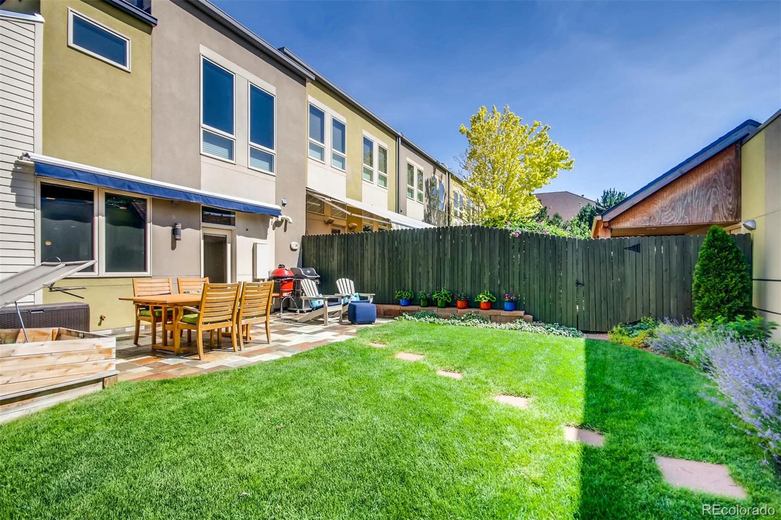 3231 Perry Street Denver, CO 80212 - Photo 30 of 36 a view of a chair and table in the back yard of the house