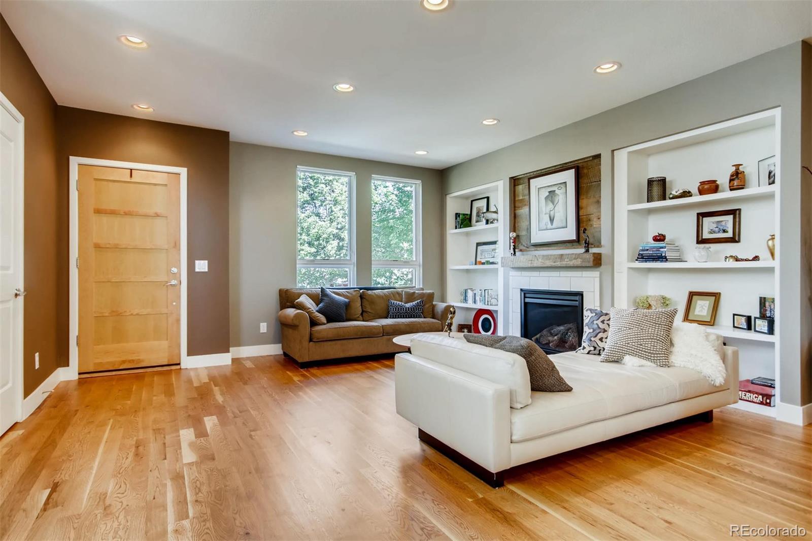 3231 Perry Street Denver, CO 80212 - Photo 5 of 36 a living room with furniture and a fireplace