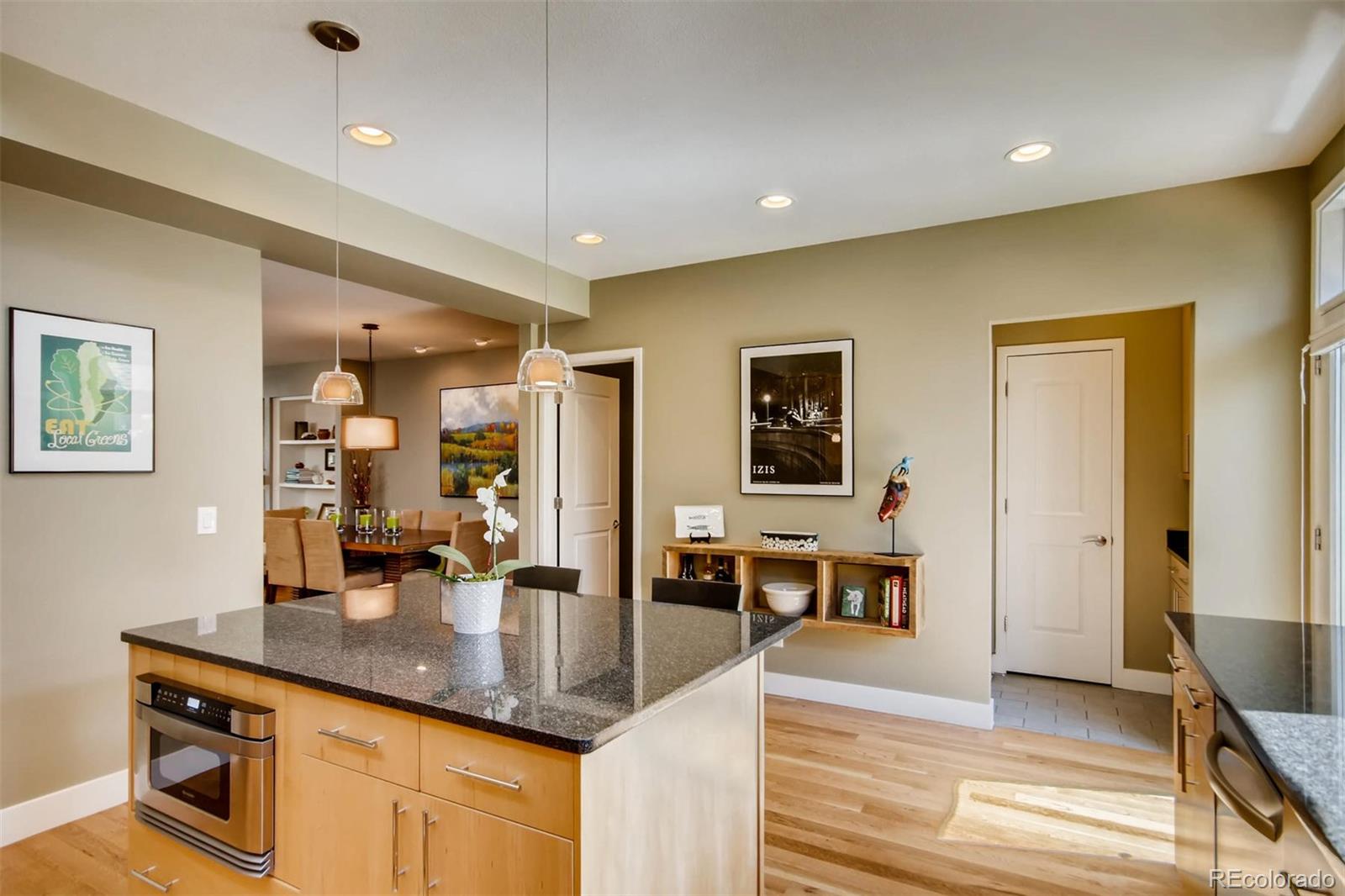 3231 Perry Street Denver, CO 80212 - Photo 8 of 36 a kitchen with counter top space and painting on the wall