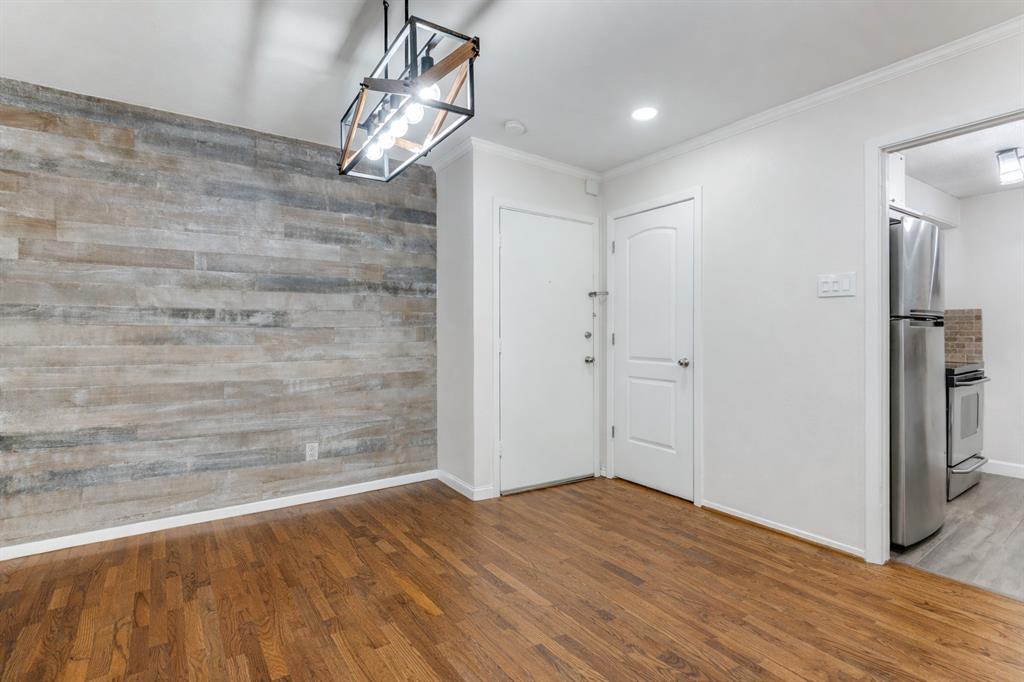 4851 Cedar Springs Road, Unit 383 Dallas, TX 75219 - Photo 4 of 19 a view of a livingroom with wooden floor