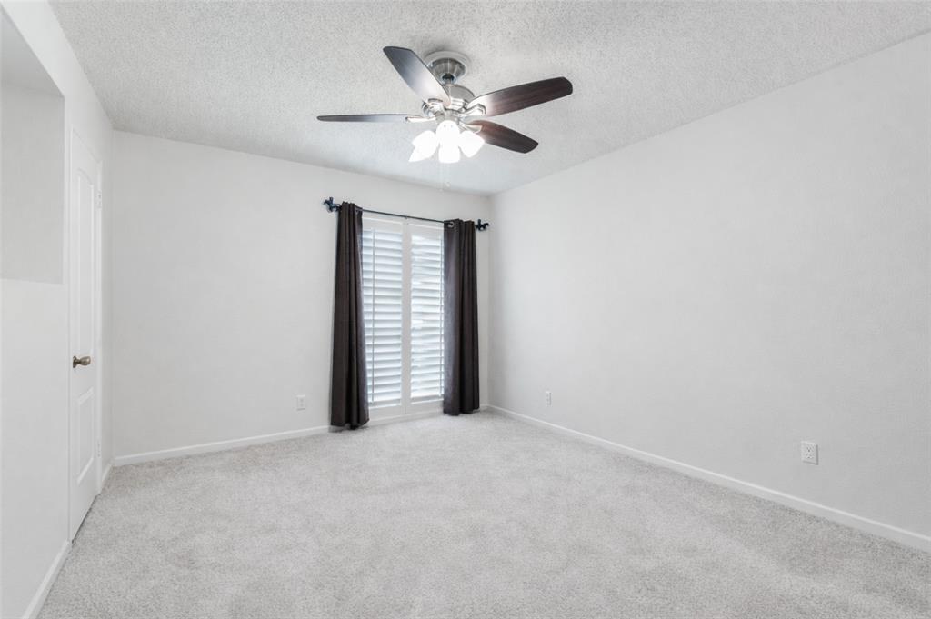 4851 Cedar Springs Road, Unit 383 Dallas, TX 75219 - Photo 8 of 19 an empty room with closet and windows
