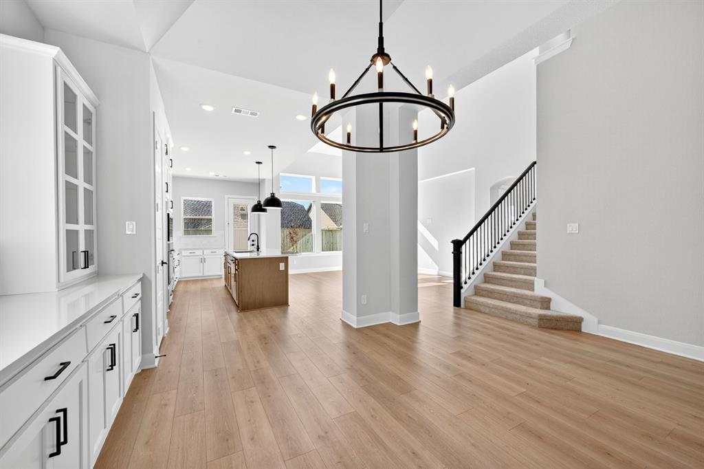 2109 Chance Lane Northlake, TX 76247 - Photo 26 of 36 a view of a kitchen with furniture and wooden floor
