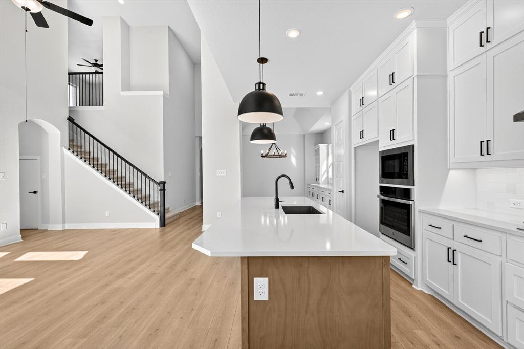 2109 Chance Lane Northlake, TX 76247 - Photo 29 of 36 a kitchen with stainless steel appliances a refrigerator sink and stove