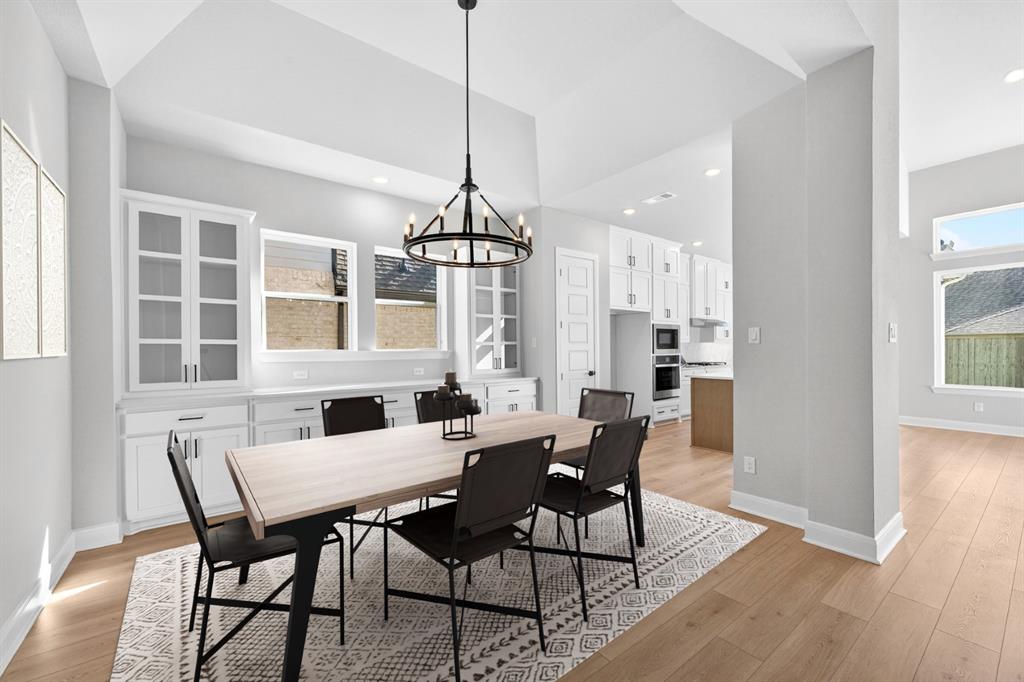 2109 Chance Lane Northlake, TX 76247 - Photo 8 of 36 a view of a dining room with furniture window and wooden floor