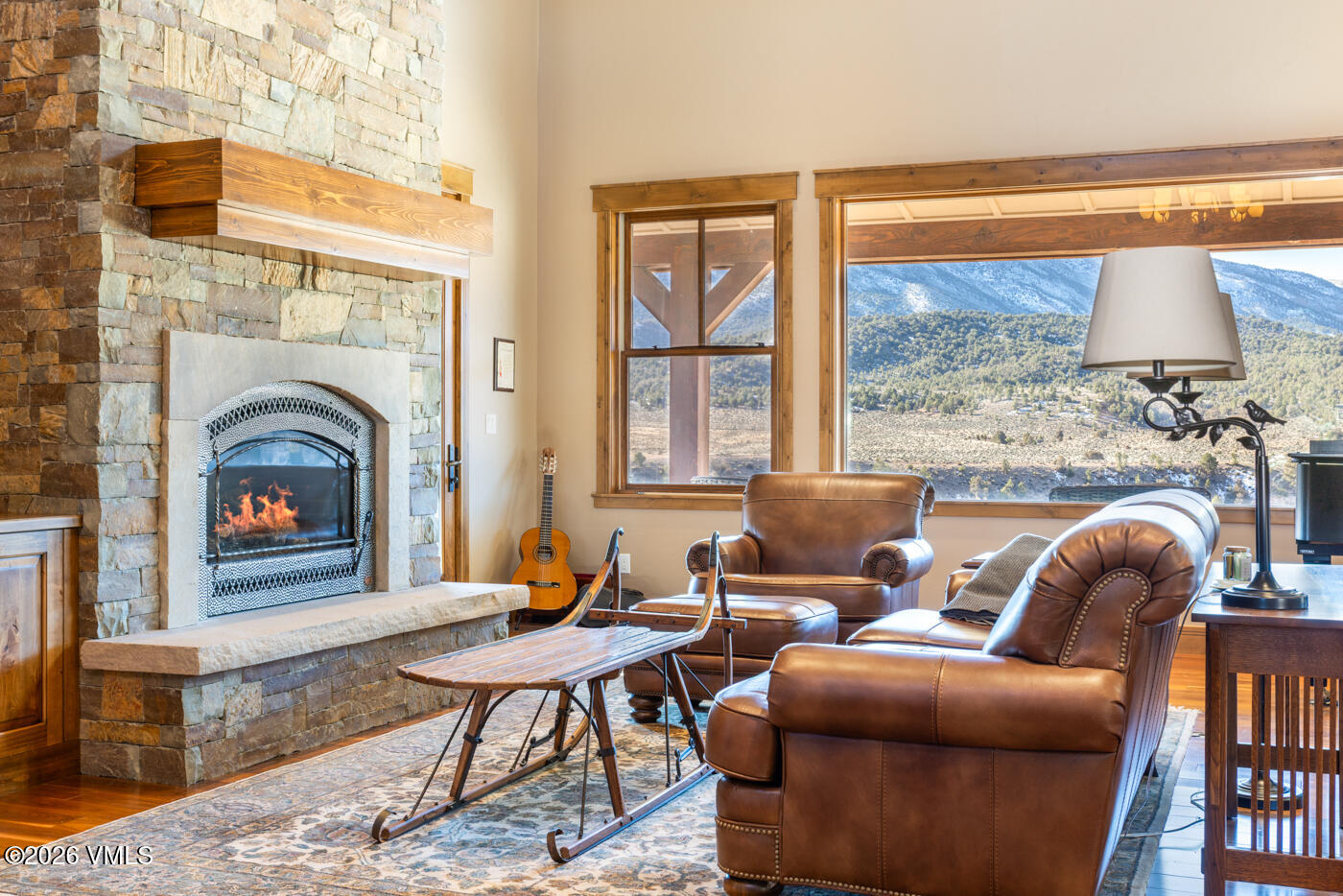 34900 Colorado River Road McCoy, CO 80463 - Photo 11 of 41 a living room with furniture a rug and a fireplace