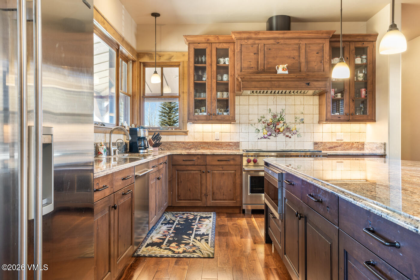 34900 Colorado River Road McCoy, CO 80463 - Photo 16 of 41 a kitchen with stainless steel appliances granite countertop a sink and stove