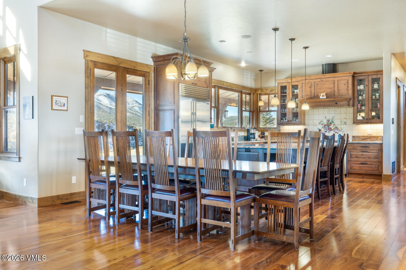 34900 Colorado River Road McCoy, CO 80463 - Photo 18 of 41 a dining room with furniture a chandelier and wooden floor