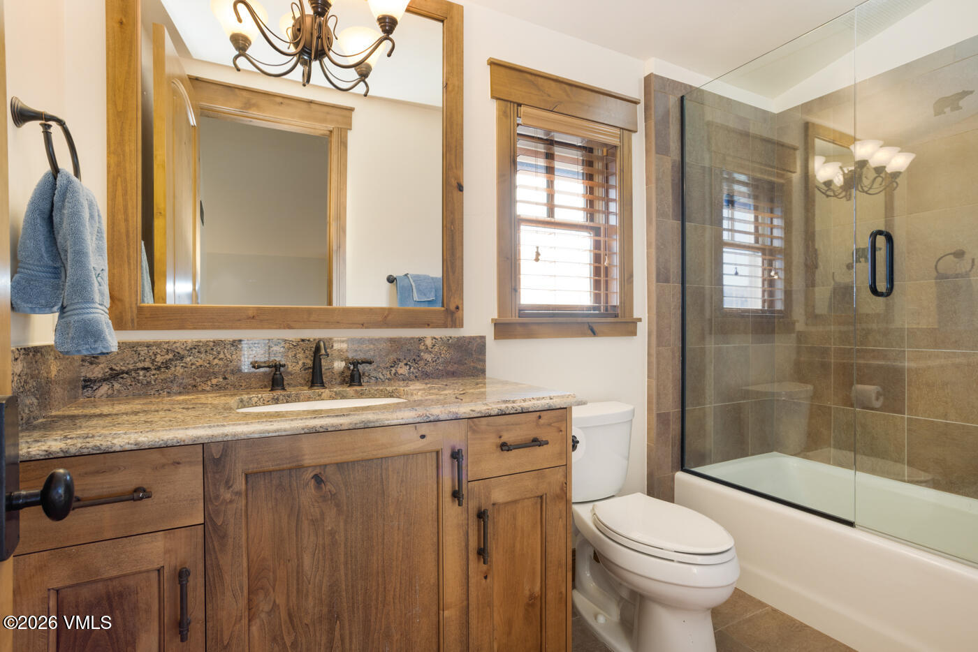 34900 Colorado River Road McCoy, CO 80463 - Photo 31 of 41 a bathroom with a granite countertop sink toilet and shower