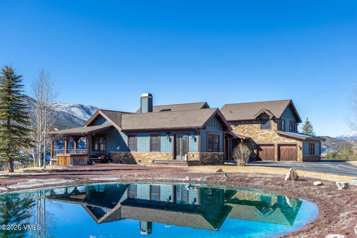 34900 Colorado River Road McCoy, CO 80463 - Photo 8 of 41 a front view of a house with swimming pool having outdoor seating