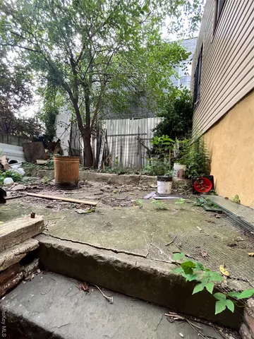 a view of a backyard with trees