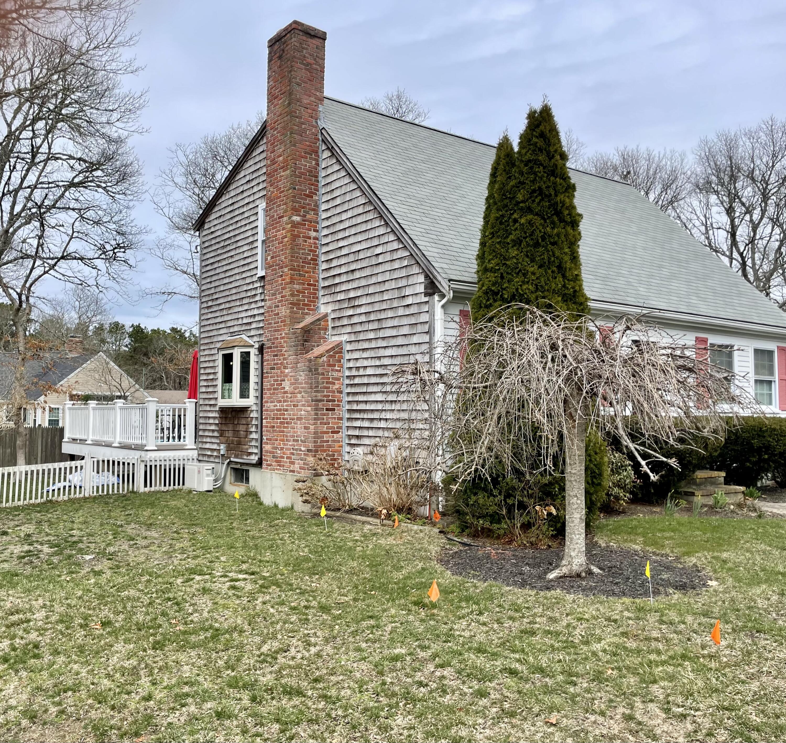 10 Chadwick Road South Dennis, MA 02660 - Photo 5 of 47 left side of home a bit further away