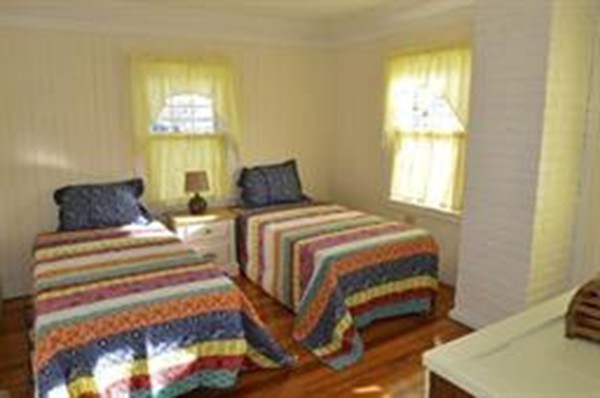111 Turner Road Scituate, MA 02066 - Photo 13 of 24 a bedroom with a bed and a window