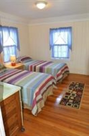 111 Turner Road Scituate, MA 02066 - Photo 15 of 24 a bedroom with a bed and a window
