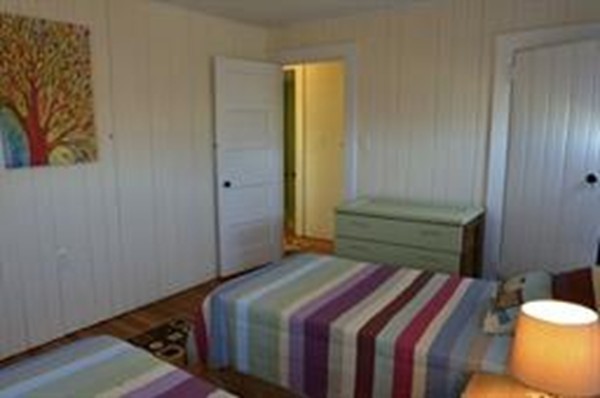 111 Turner Road Scituate, MA 02066 - Photo 16 of 24 a bedroom with a bed and a window