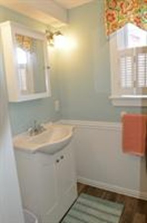 111 Turner Road Scituate, MA 02066 - Photo 21 of 24 a bathroom with a sink and a mirror