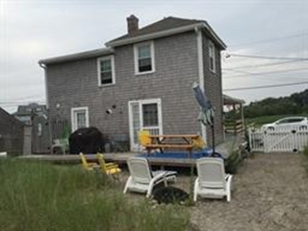 111 Turner Road Scituate, MA 02066 - Photo 3 of 24 a backyard of a house with table and chairs
