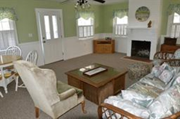 111 Turner Road Scituate, MA 02066 - Photo 6 of 24 a living room with furniture and a fireplace