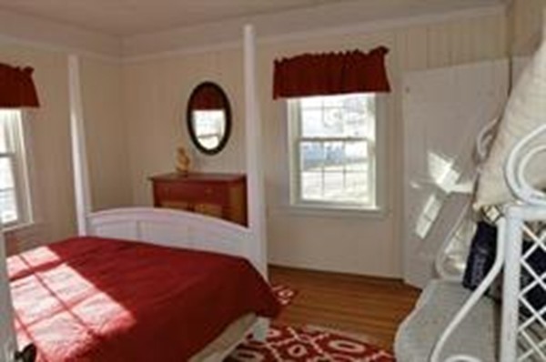 111 Turner Road Scituate, MA 02066 - Photo 10 of 24 a bedroom with a bed and a window