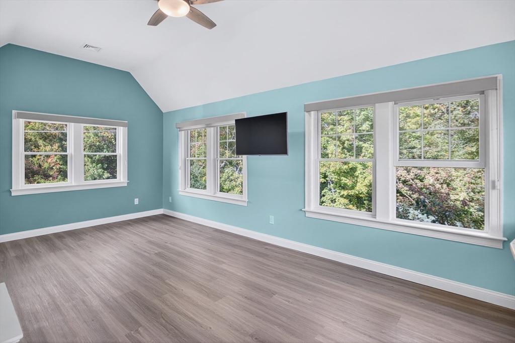 128 Uncle Percy's Road Mashpee, MA 02649 - Photo 19 of 42 a view of an empty room with wooden floor and a window