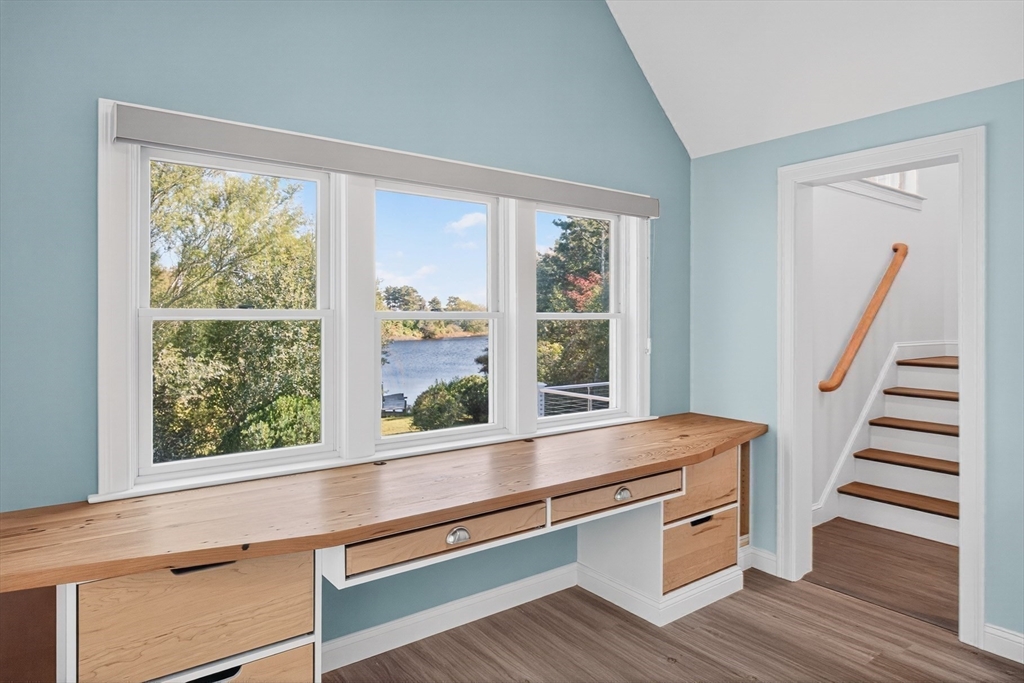 128 Uncle Percy's Road Mashpee, MA 02649 - Photo 21 of 42 a view of wooden floor and windows in a room