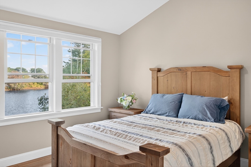 128 Uncle Percy's Road Mashpee, MA 02649 - Photo 27 of 42 a bedroom with a bed and a window