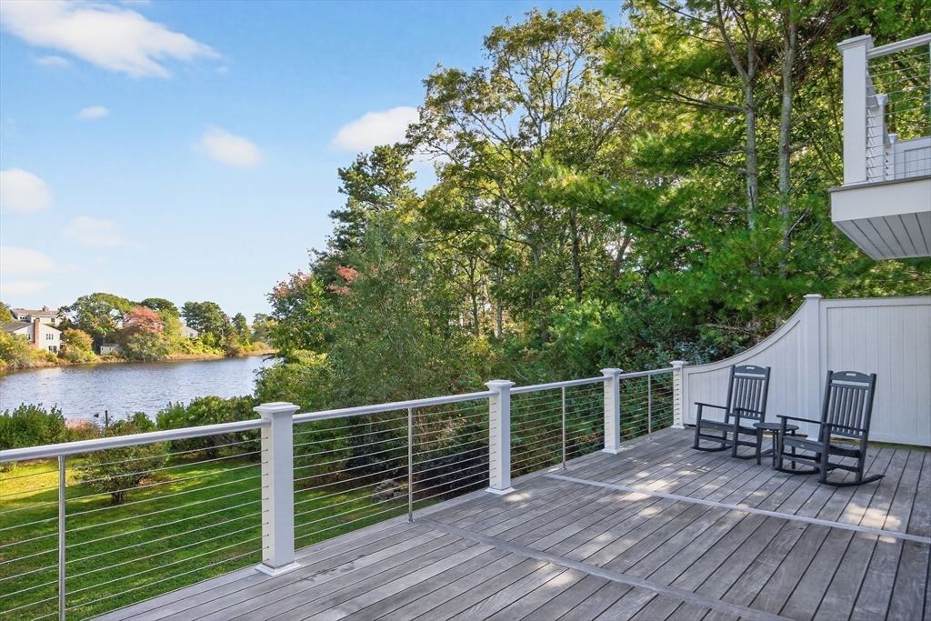 128 Uncle Percy's Road Mashpee, MA 02649 - Photo 31 of 42 a view of a balcony with chairs