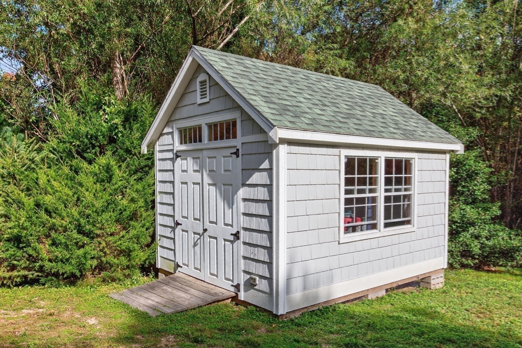 128 Uncle Percy's Road Mashpee, MA 02649 - Photo 33 of 42 a house view with a garden space