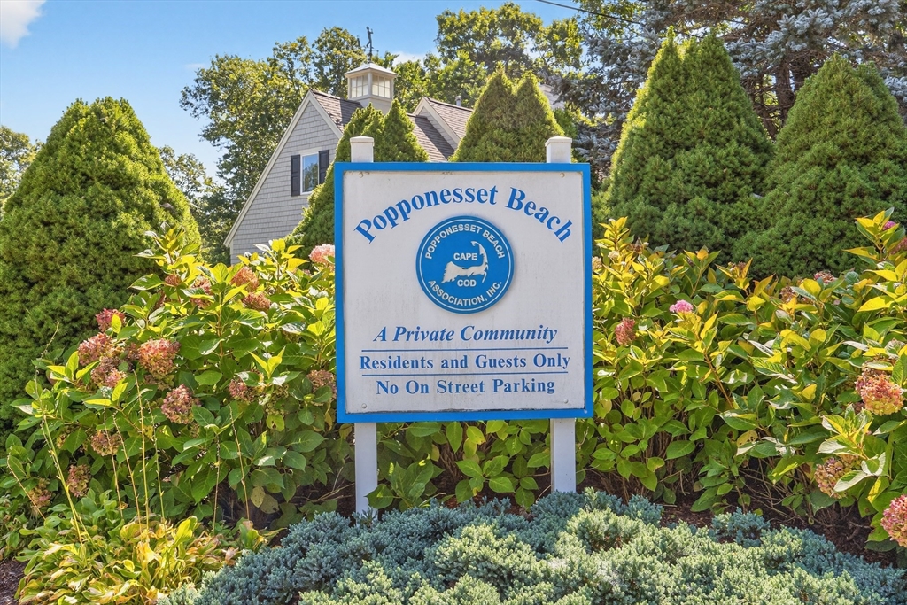 128 Uncle Percy's Road Mashpee, MA 02649 - Photo 39 of 42 a sign broad in front of flowers
