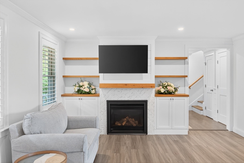 128 Uncle Percy's Road Mashpee, MA 02649 - Photo 6 of 42 a living room with furniture and a fireplace