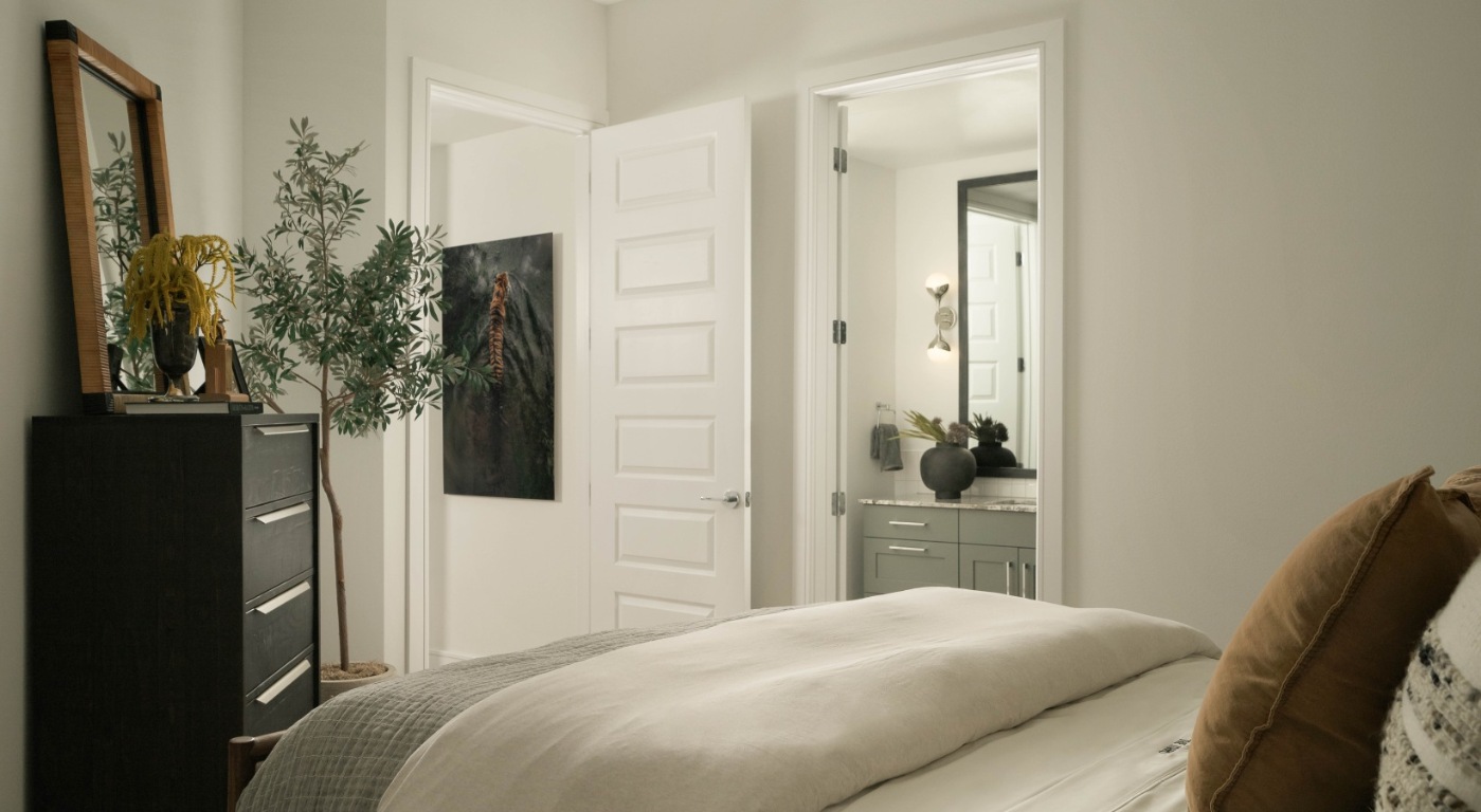 10520 Lakeline Mall Drive, Unit 215 Austin, TX 78717 - Photo 4 of 23 a bedroom with a bed and a potted plant