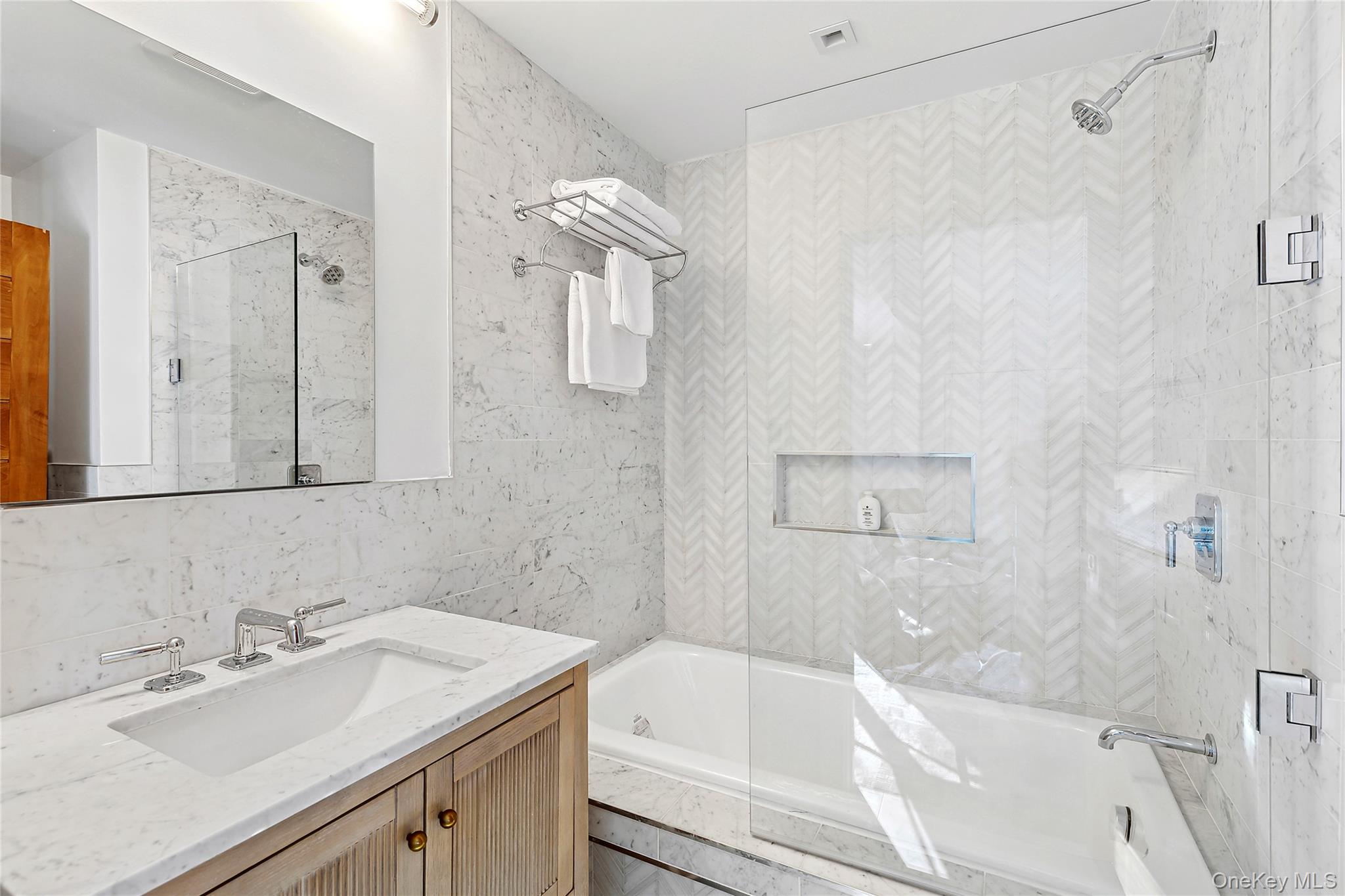 221 Redwood Road Sag Harbor, NY 11963 - Photo 11 of 19 a bathroom with a sink vanity tub and shower